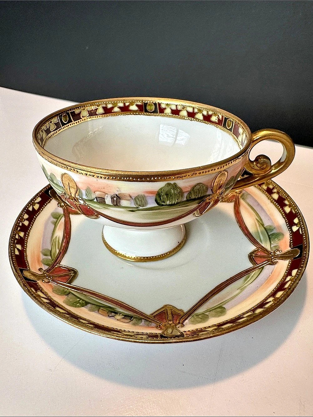Nippon Hand Painted Teacup and Saucer White bone China Heavy gold trim